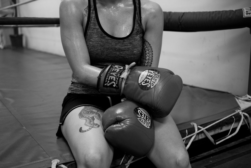 Casey takes a short break on the side of the ring in between a sparring session at World Class Boxing Gym in San Francisco, CA.