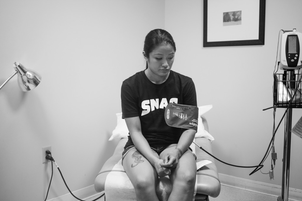 Casey awaits for her doctor to take her blood-pressure reading. This is one of many physical tests Casey must get in order to prove she is healthy for her pro-debut.