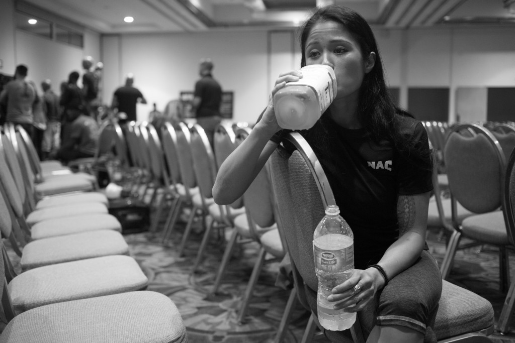 To ward off hunger pains, Casey drinks large amounts of water and meal supplements after her first weigh-in for her pro-debut. Boxers are restricted to very little food and liquid intakes the day before weigh-ins so that they can make their goal weight.