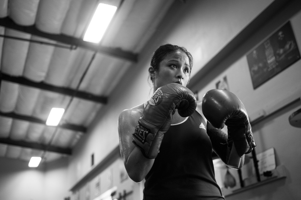 Casey practices training by herself at Undisputed Boxing Gym to improve techniques and practice self-discipline for her upcoming boxing fights.