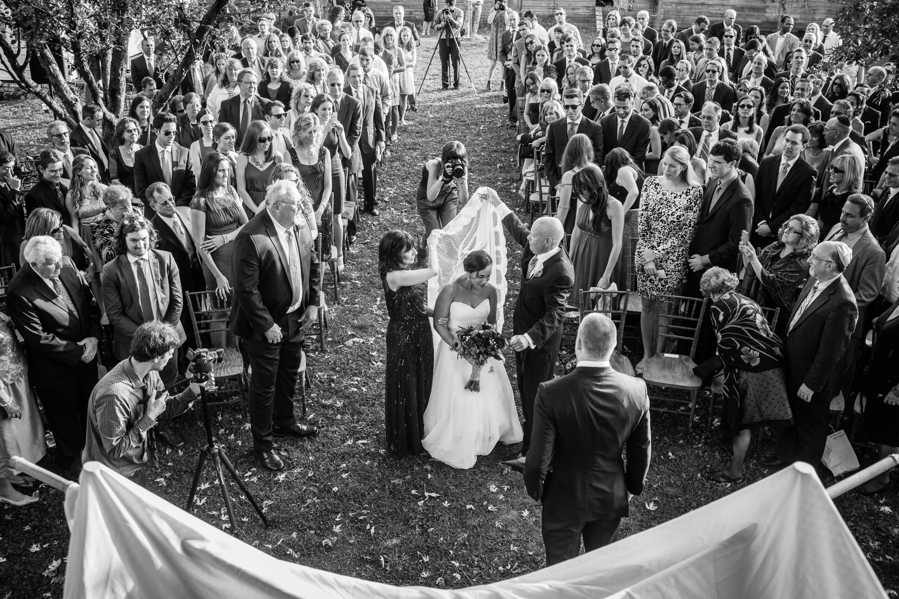 During traditional Jewish wedding ceremonies, the brides’ parents walk her down the aisle. With all the strength they could muster, Laurel and Howie walked with Nancy, their daughter, holding her close as they lifted her veil and greeted her fiancé in front of the chuppah. Knowing that his disease was progressing fast, Howie  cherished every moment as he knew it would be one of his last good ones. Highland, NY. October 2013.